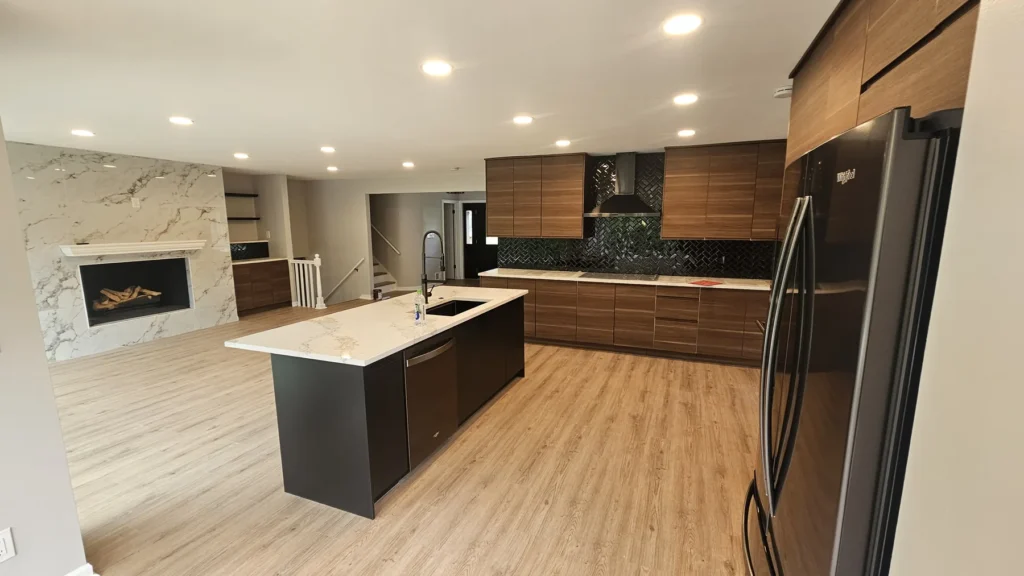 Modern kitchen remodel featuring custom cabinets, waterfall island, quartz countertops, and premium finishes by GetFix4U