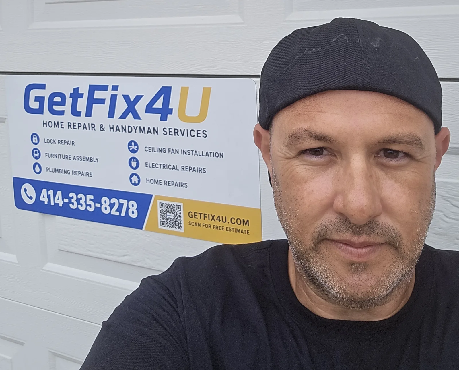 GetFix4U owner beside the company service sign and phone number.