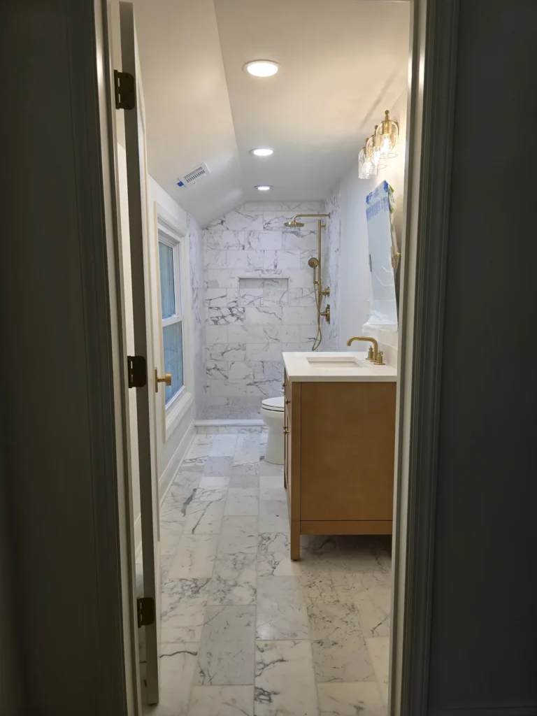 Marble tile bathroom remodel with custom vanity, luxury shower, and premium finishes completed by GetFix4U